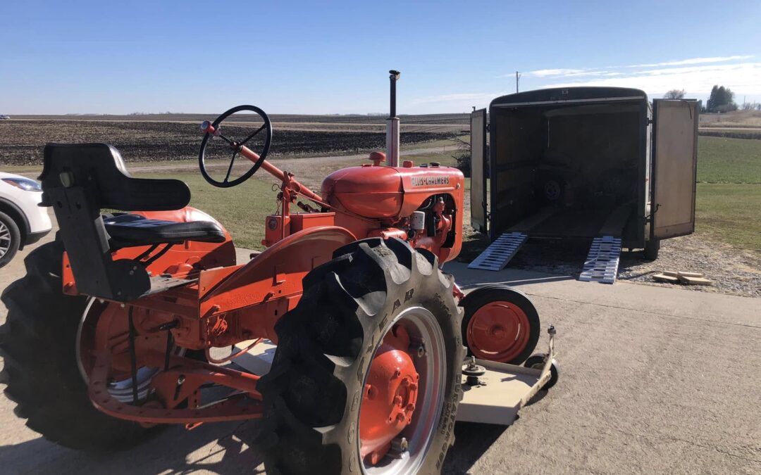 Hauling tractors in a furniture trailer